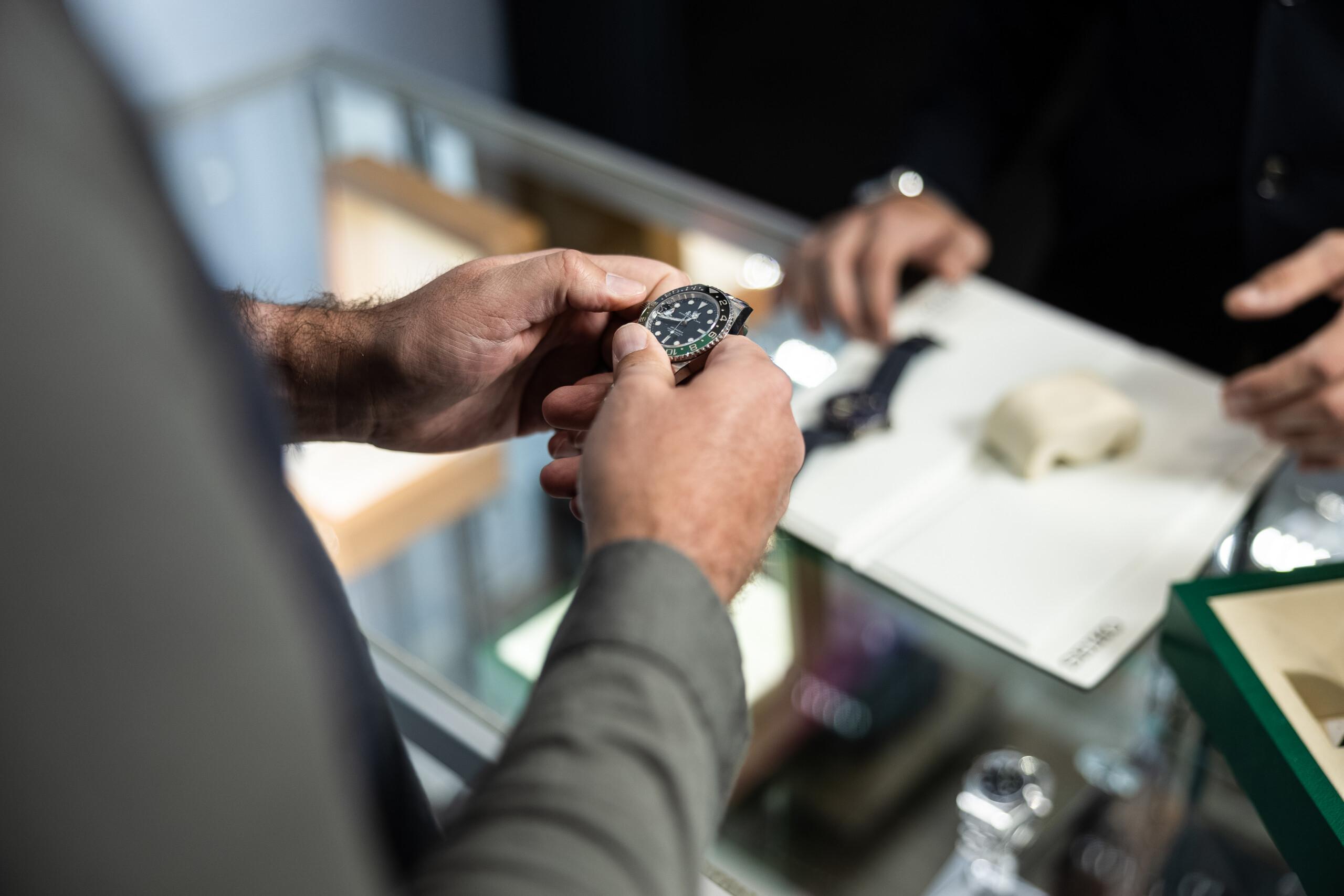 Luxurious A-List Wrist Watch being examined at a high-end store.